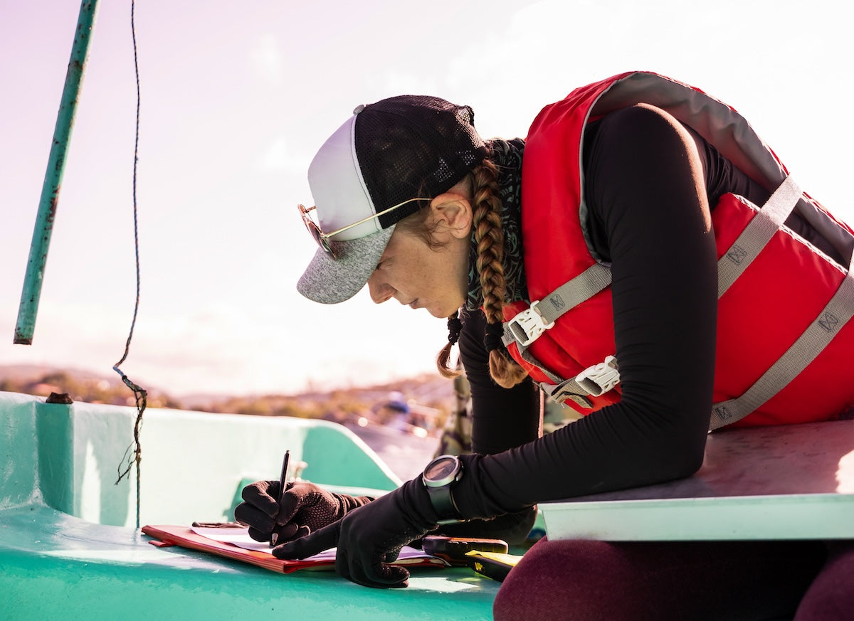 Scientist female taking notes iStock 1464588742 OEM LR adjusted compressed